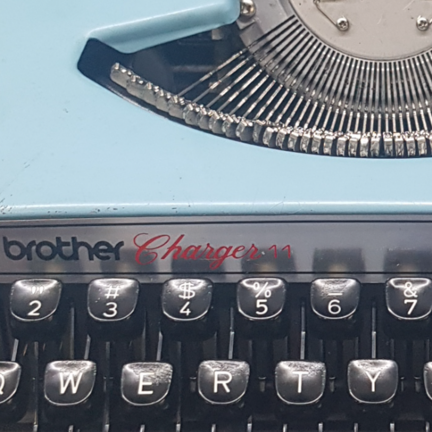 Image of Brother Charger 11 Typewriter. Portable Typewriter. Original Blue. Made in Japan. Available from universaltypewritercompany.in.