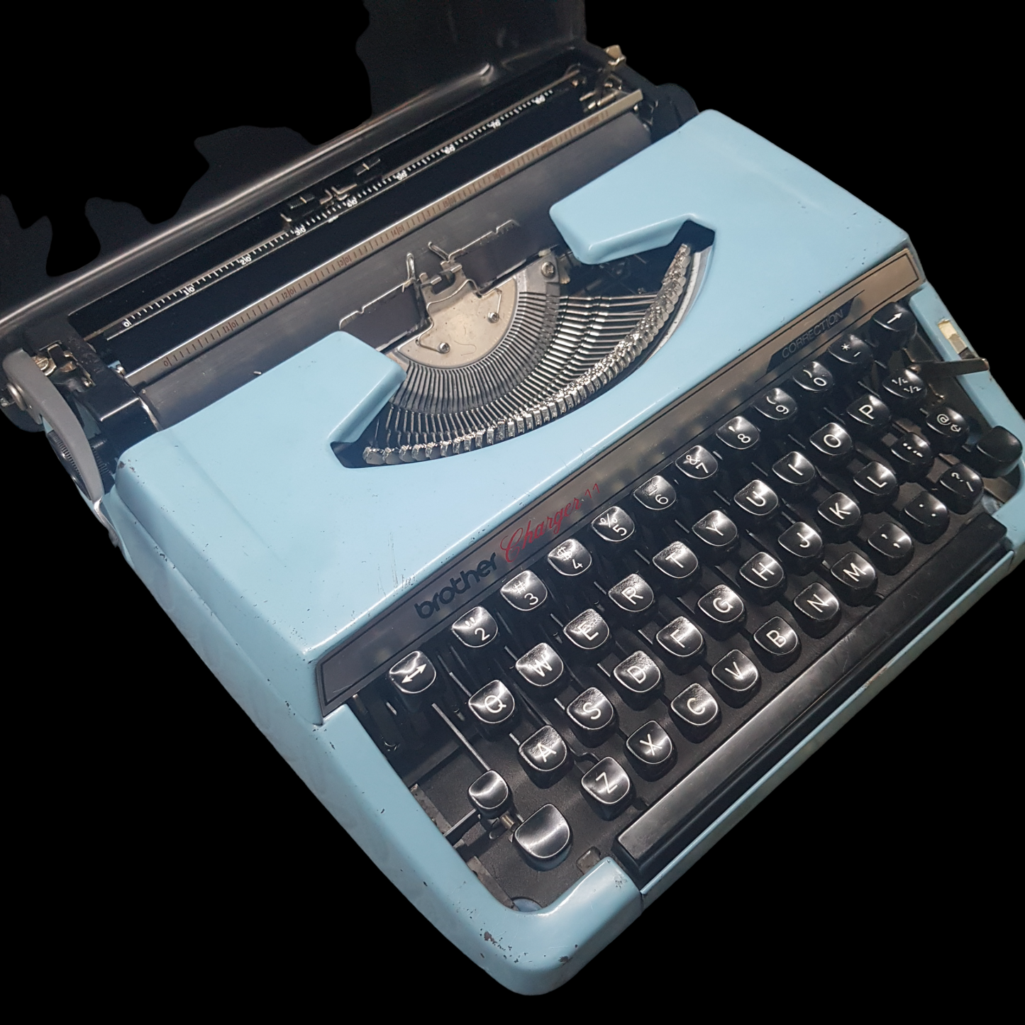 Image of Brother Charger 11 Typewriter. Portable Typewriter. Original Blue. Made in Japan. Available from universaltypewritercompany.in.