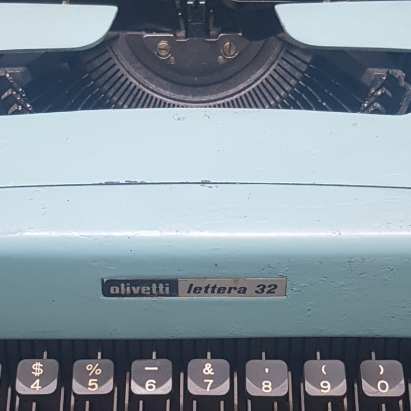 Image of Olivetti Lettera 32 Typewriter. Portable Typewriter. Original Blue. Italian Made. Available with cover. Available from universaltypewritercompany.in
