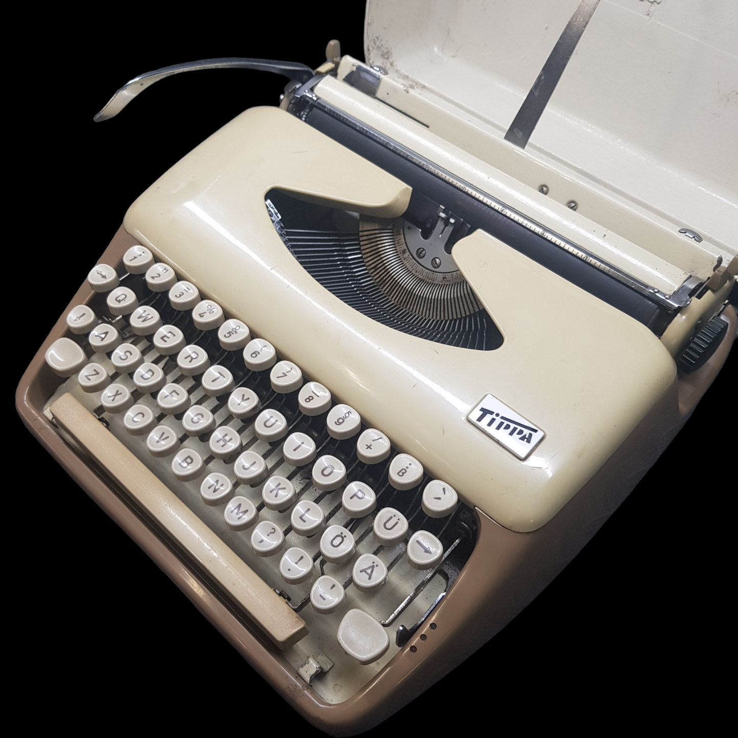 Image of Adler Tippa Portable Typewriter. Almost smallest portable typewriter. Made in Germany. Available from universaltypewritercompany.in