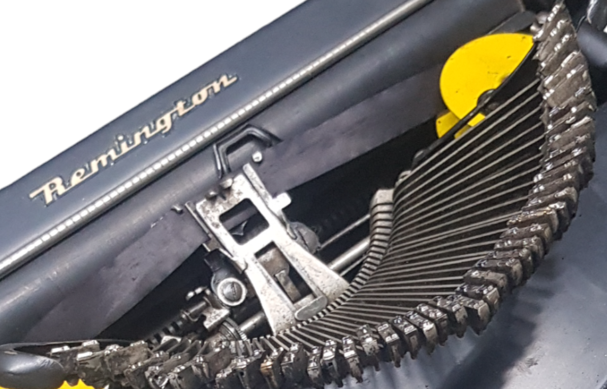 Image of Remington Mode 2 Lifting Typewriter. A Rare Antique Century old Metal Keyring Portable Typewriter. Made in the USA. Available from Universal Typewriter Company.
