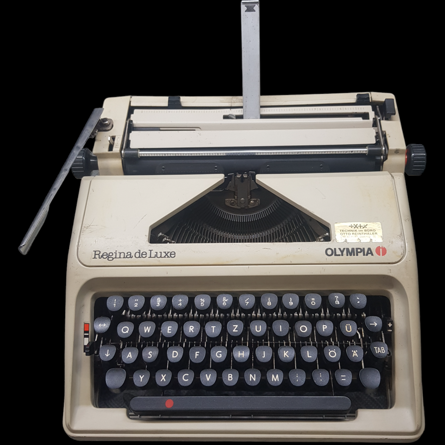 Image of Olympia Regina DLX Typewriter. A Midsize Portable Typewriter. Made in Germany. Fibre Body. Available from universaltypewritercompany.in.