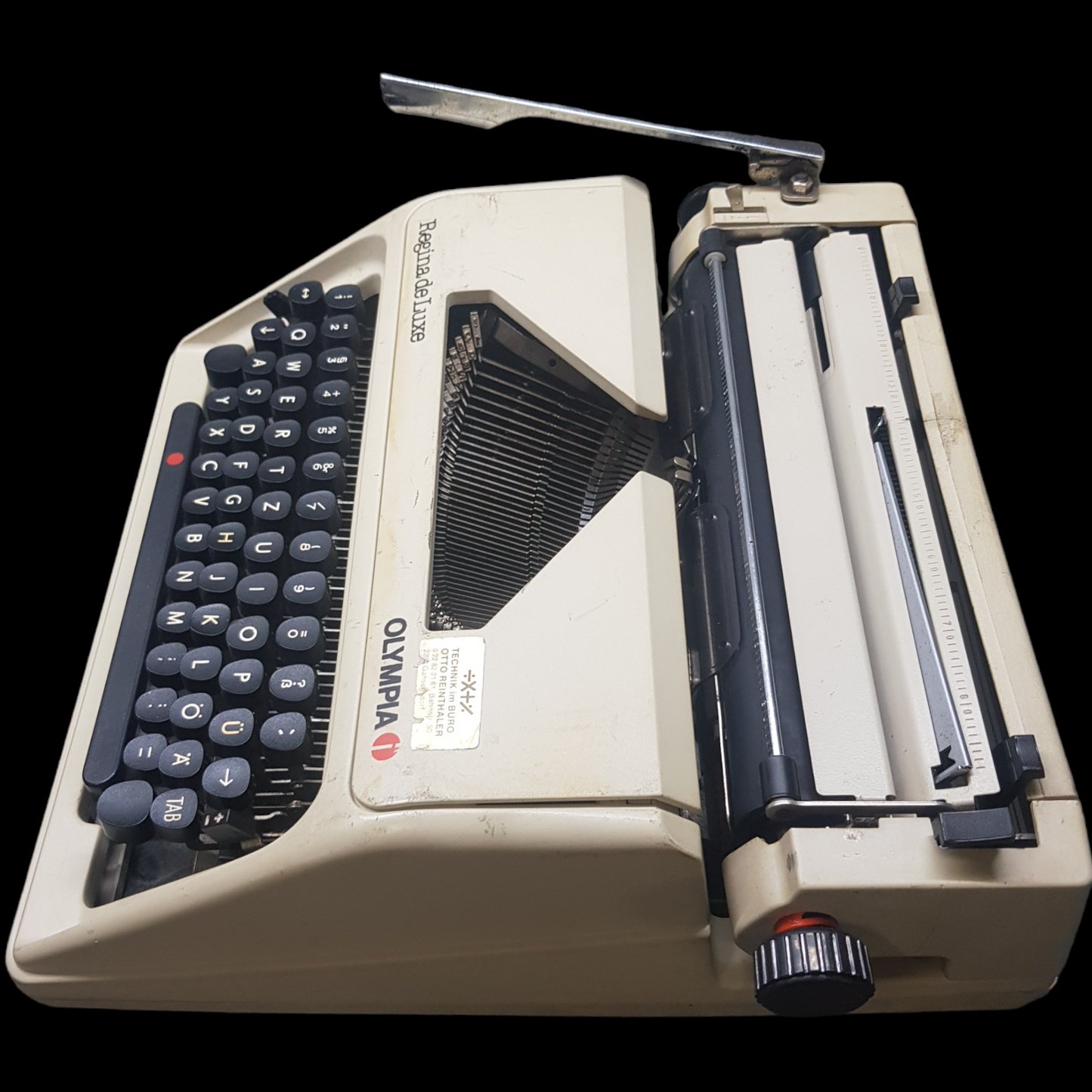 Image of Olympia Regina DLX Typewriter. A Midsize Portable Typewriter. Made in Germany. Fibre Body. Available from universaltypewritercompany.in.
