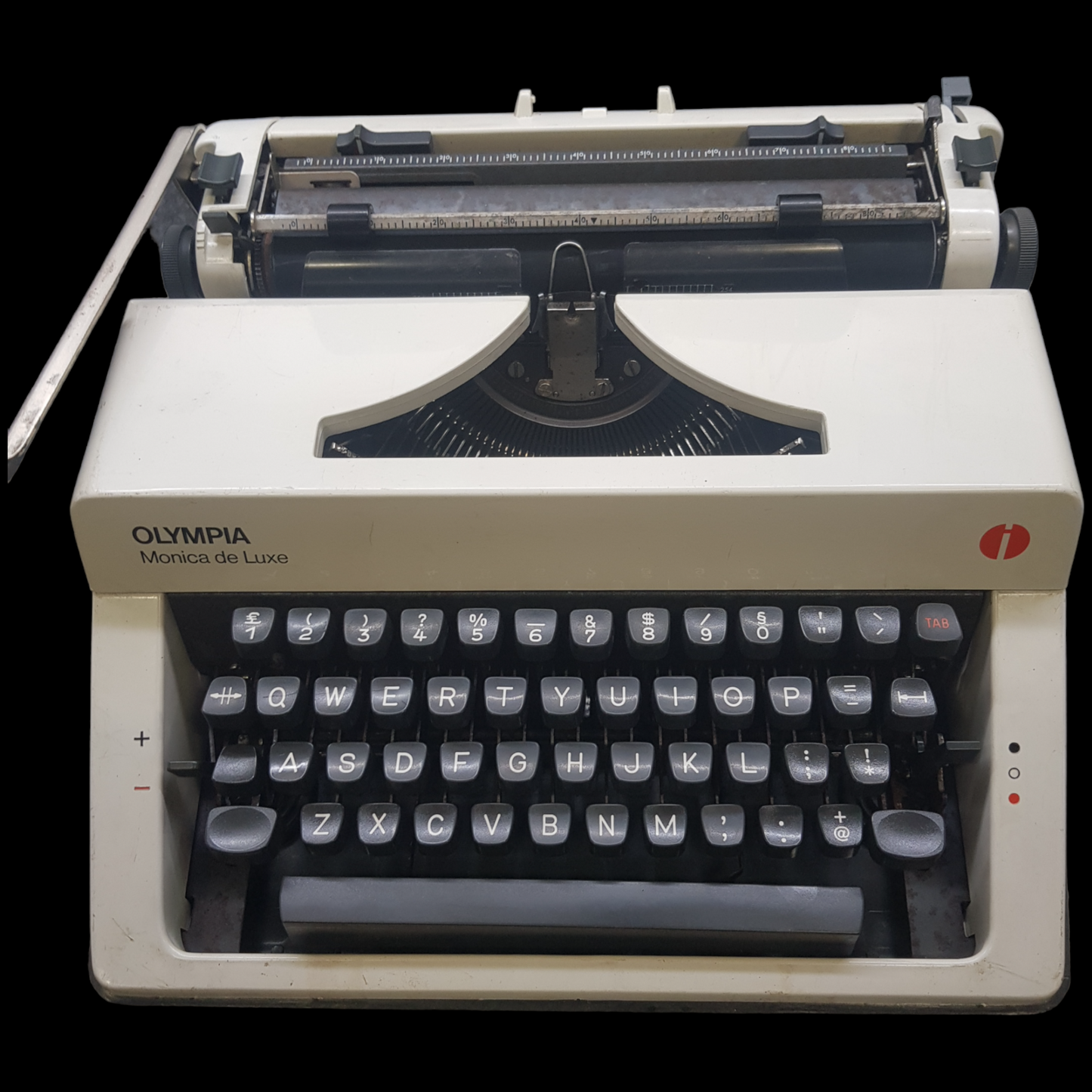 Image of Olympia Monica DLX Typewriter. A Midsize Portable Typewriter. Made in Germany. Fibre Body. Available from universaltypewritercompany.in.