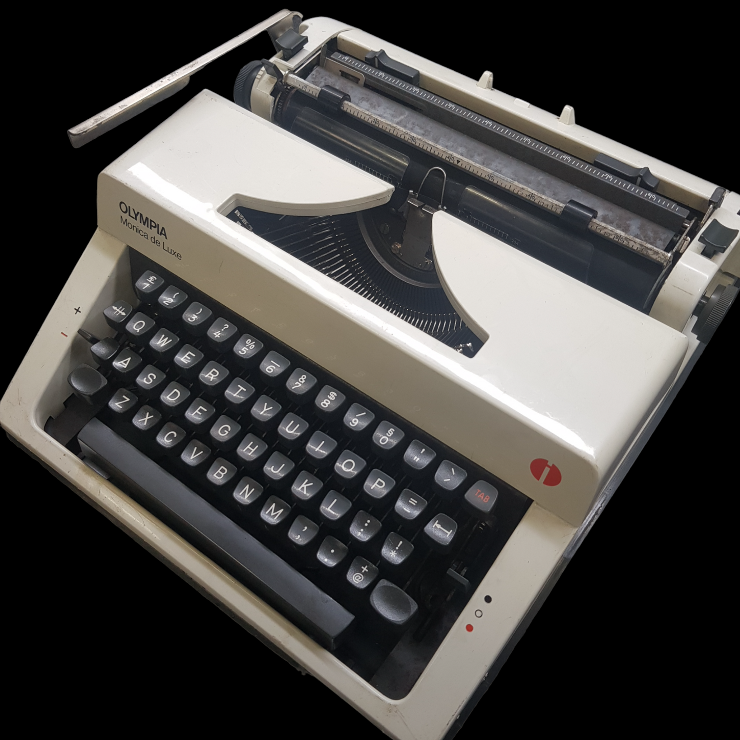 Image of Olympia Monica DLX Typewriter. A Midsize Portable Typewriter. Made in Germany. Fibre Body. Available from universaltypewritercompany.in.