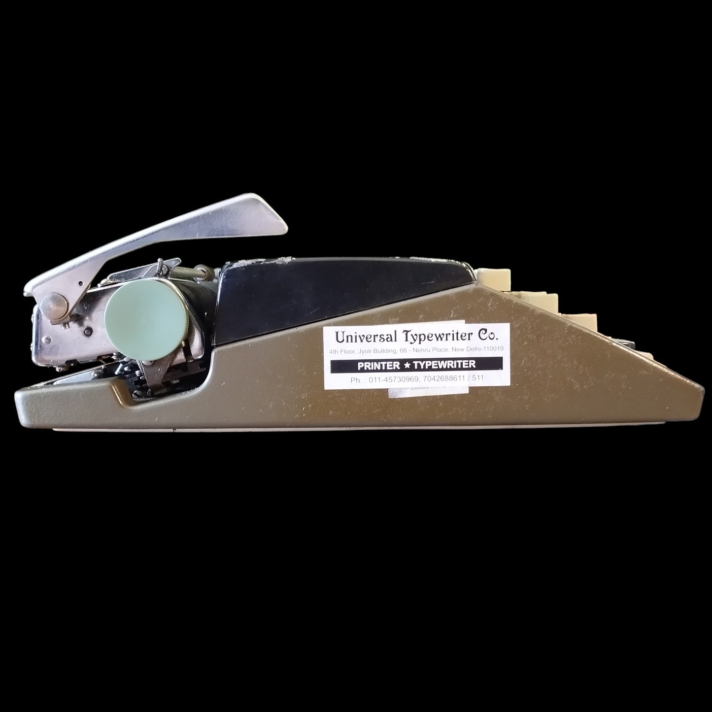 Image of Olympia Port SF DLX Typewriter. Available from universaltypewritercompany.in