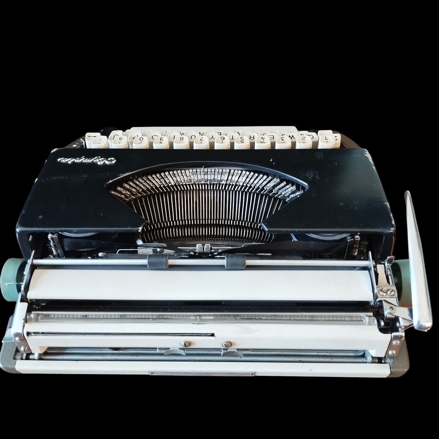 Image of Olympia Port SF DLX Typewriter. Available from universaltypewritercompany.in