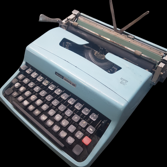 Image of Olivetti Lettera 32 Typewriter. Portable Typewriter. Original Blue. Italian Made. Available with cover. Available from universaltypewritercompany.in