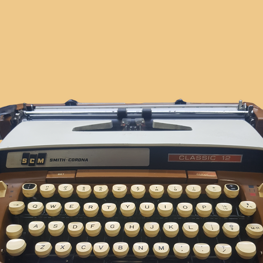 Image of SCM Smith Corona Classic Typewriter. A Big Portable typewriter. Made in the USA. Available from Universal Typewriter Company.