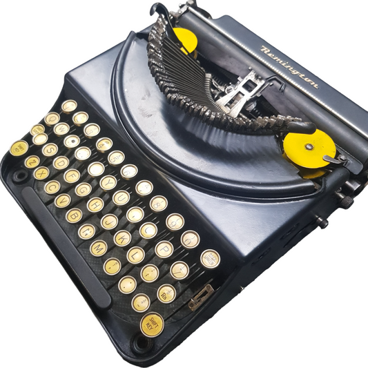 Image of Remington Mode 2 Lifting Typewriter. A Rare Antique Century old Metal Keyring Portable Typewriter. Made in the USA. Available from Universal Typewriter Company.