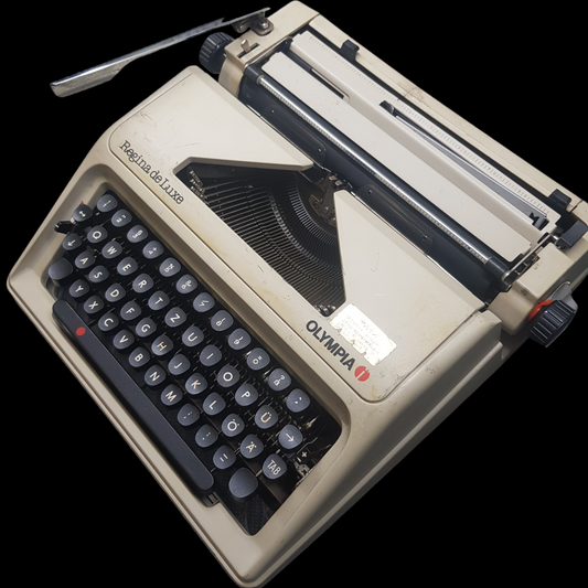 Image of Olympia Regina DLX Typewriter. A Midsize Portable Typewriter. Made in Germany. Fibre Body. Available from universaltypewritercompany.in.