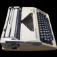 Image of Olympia Regina DLX Typewriter. A Midsize Portable Typewriter. Made in Germany. Fibre Body. Available from universaltypewritercompany.in.