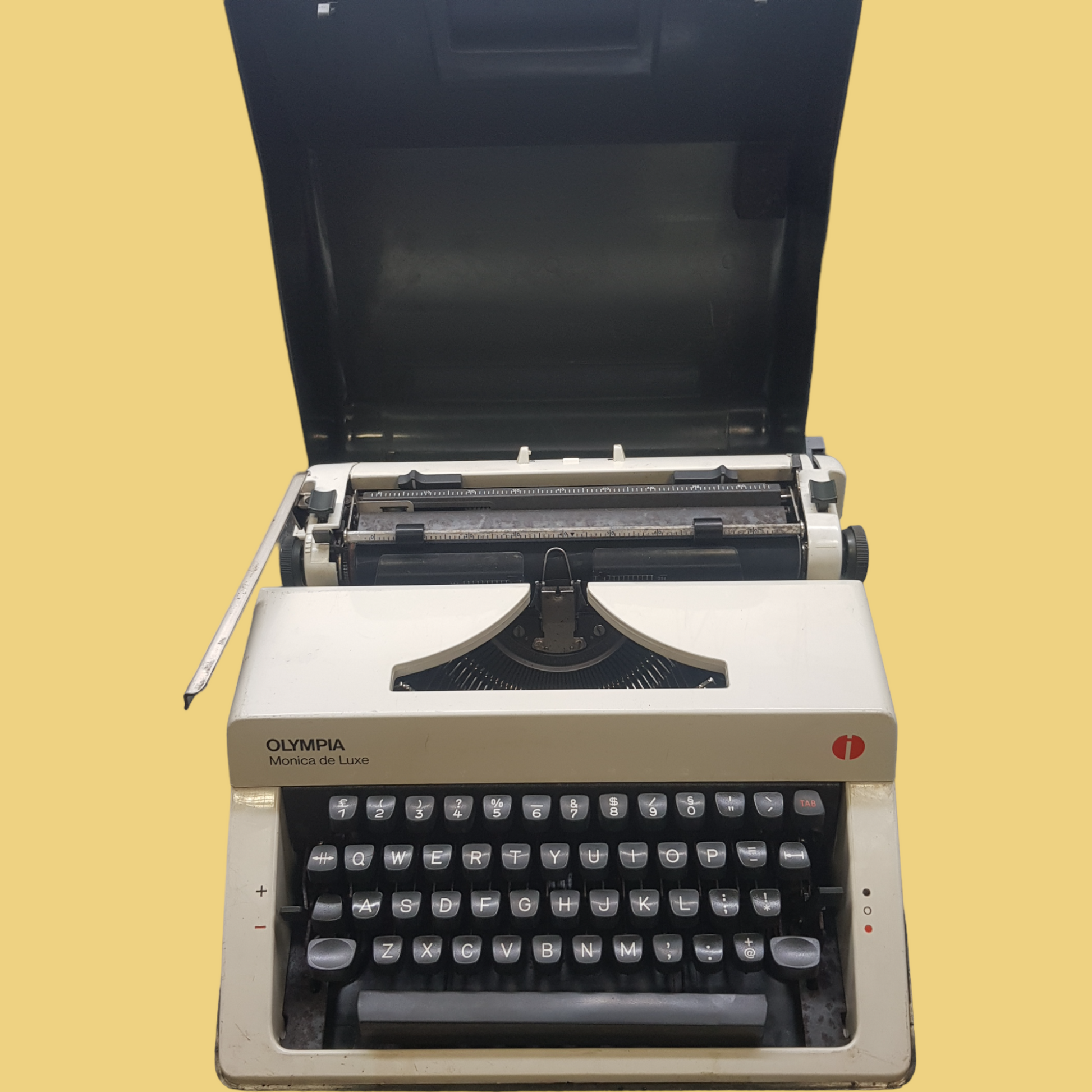 Image of Olympia Monica DLX Typewriter. A Midsize Portable Typewriter. Made in Germany. Fibre Body. Available from universaltypewritercompany.in.
