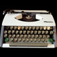 Image of Olympia Port SF DLX Typewriter. Available from universaltypewritercompany.in