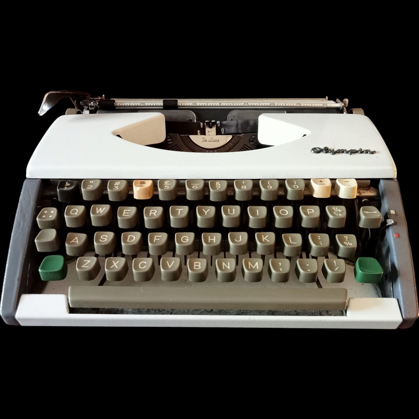 Image of Olympia Port SF DLX Typewriter. Available from universaltypewritercompany.in