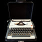 Image of Olympia Traveller De Luxe Typewriter. Available from universaltypewritercompany.in