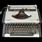 Image of Olympia Traveller De Luxe Typewriter. Available from universaltypewritercompany.in