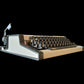 Image of Olympia Traveller De Luxe Typewriter. Available from universaltypewritercompany.in