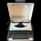 Image of Olympia Traveller De Luxe Typewriter. Available from universaltypewritercompany.in