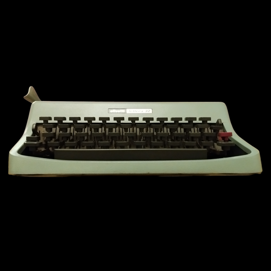 Image of Olivetti Lettera 32 Typewriter. Portable Typewriter. Original Blue. Italian Made. Available with cover. Available from universaltypewritercompany.in