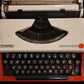 Image of Olympia Traveller De Luxe Typewriter. Available from universaltypewritercompany.in
