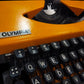 Image of Olympia Traveller De Luxe Typewriter. Available from universaltypewritercompany.in