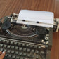 Video of Olympia Traveller De Luxe Typewriter. Available from universaltypewritercompany.in